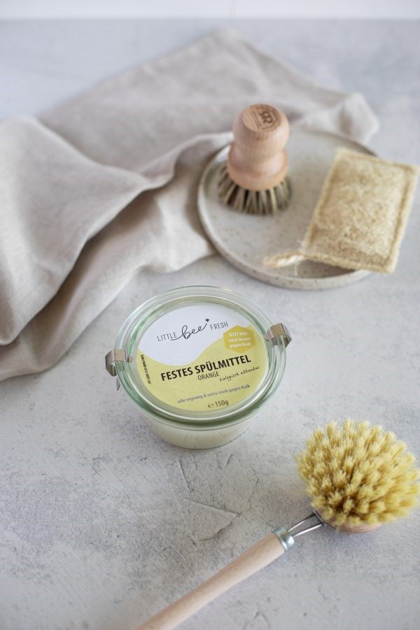 Solid dish soap in a glass jar