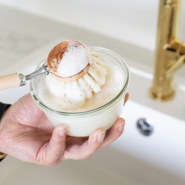 Solid dish soap in a glass jar